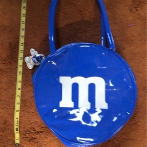 M&M bags. Like new. Has a zipper pocket inside.